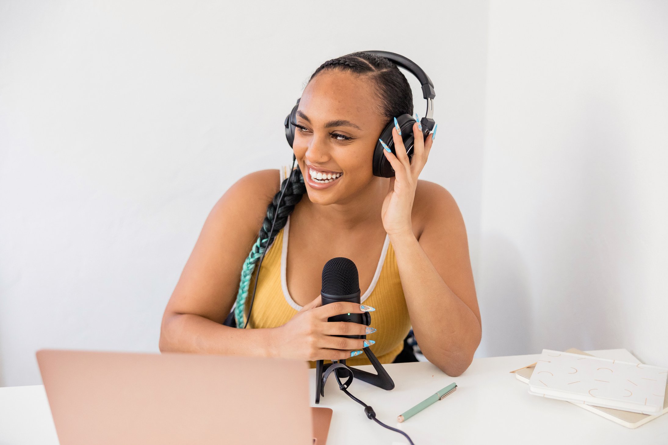 Woman Recording a Podcast at Home